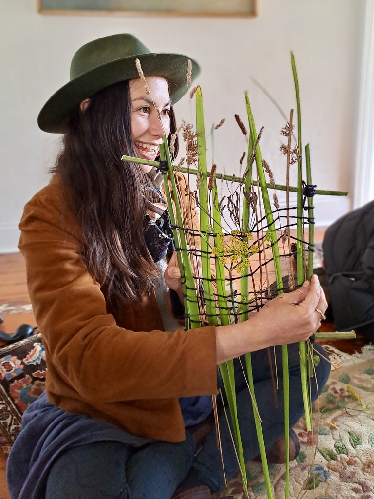 Rachael Harrex showing her woven plant wall-hanging