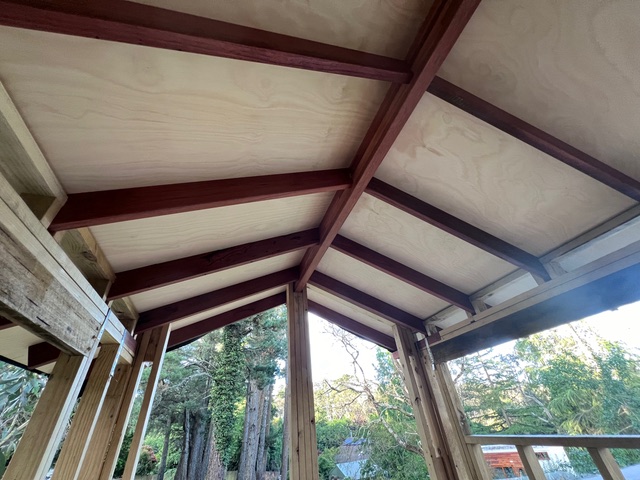 Looking up at the marine plywood roof supported by very strong beams.
