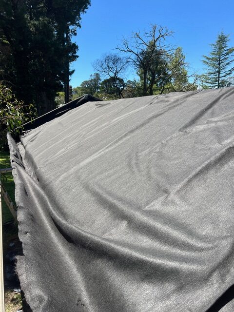 Kingspan hardboard insulation was then added. There was a gap created between the eave and the edge of the kingspan board, creating a trough for subsoil drainage. The builder’s plastic and insulation board were then covered by geofabric.
