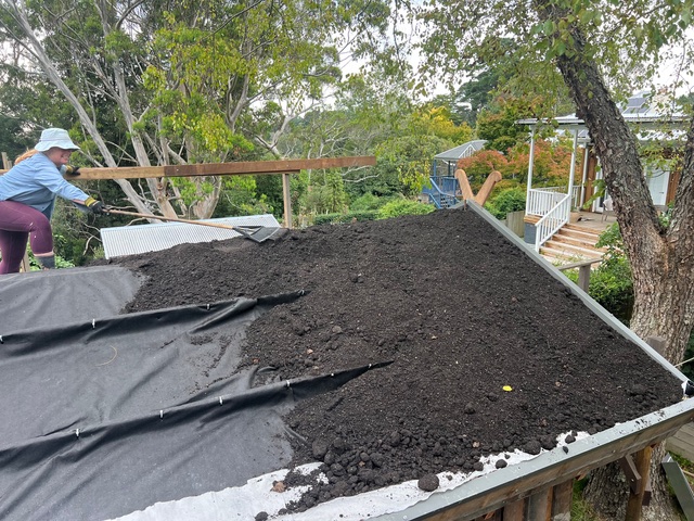 7. The roof was then partitioned into three segments and covered with another layer of geofabric. These segments acted as ribs to stop the soil washing down. Soil was then added.